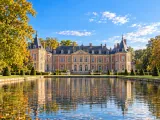 Illustration of Château de Beloeil across its long reflecting basin