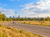 Illustration of Tempelhofer Feld runway and meadow toward the Berlin skyline