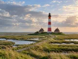 Illustration of Westerheversand lighthouse across the salt marsh