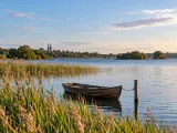 Illustration of Roskilde Fjord viewed toward distant cathedral spires