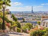 Illustration of Paris from an elevated Montmartre-style viewpoint, Eiffel Tower beyond zinc rooftops