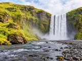 Illustration of Skógafoss waterfall, mossy cliffs and river foreground