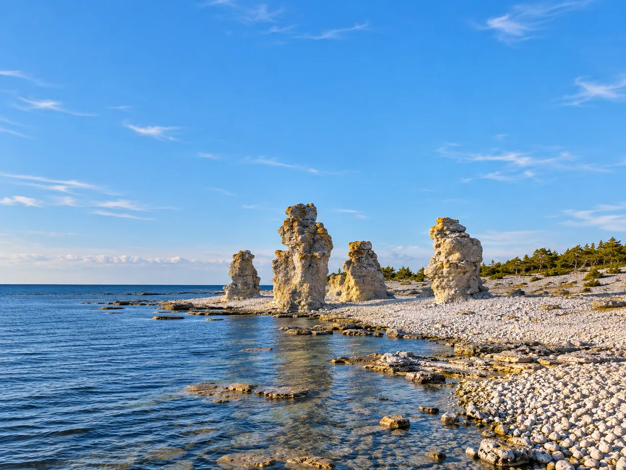 Illustration of Weathered limestone sea stacks on the shore of Fårö, Gotland