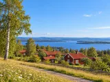 Illustration of Traditional timber village on the slope above Lake Siljan in Tällberg
