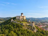 Illustration of Trenčín Castle on its rocky wooded hill above the town