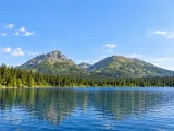 Illustration of Representative alpine lake and spruce forest beneath the High Tatras